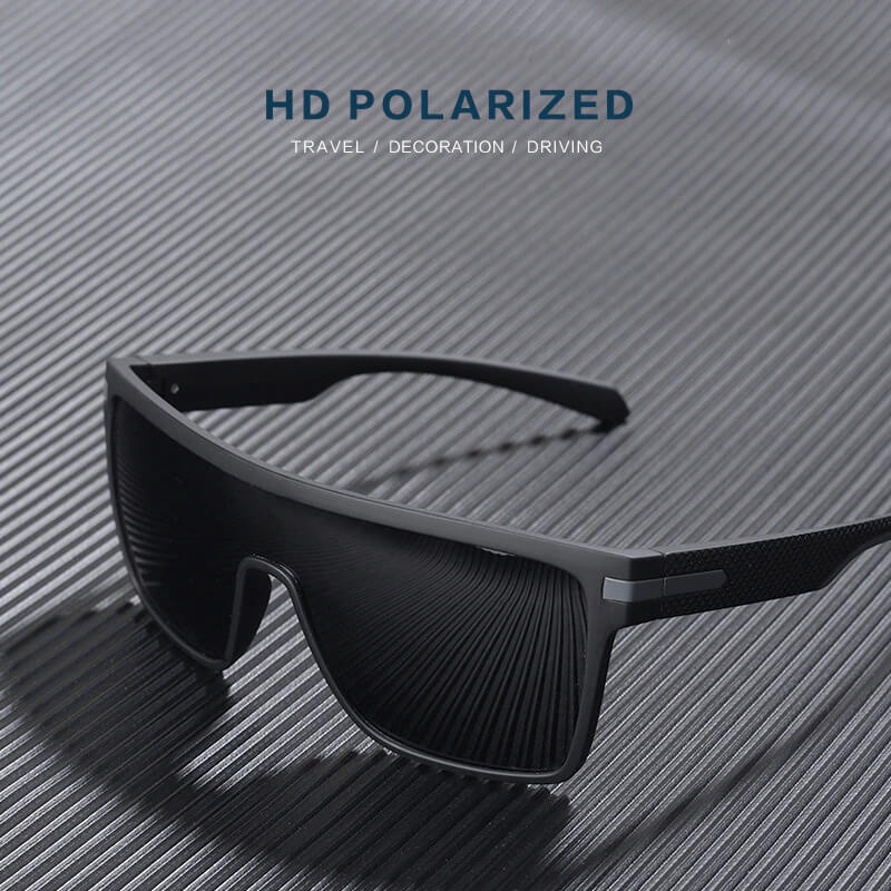 Stylish male oversized square sunglasses SF0660 with flexible frame, polarized TAC lenses, and UV400 protection on a textured surface.